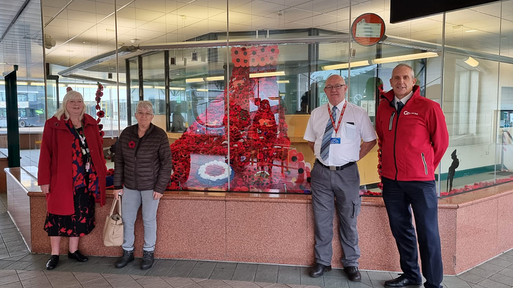 (L-R) Two of Go North East's customers who knitted poppies for the display, with bus station supervisor John Gordon and driver Neil Kennedy