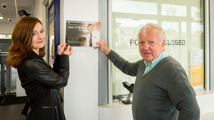Sharon Dartington and Bob Redman show where the memorial plaque will be placed