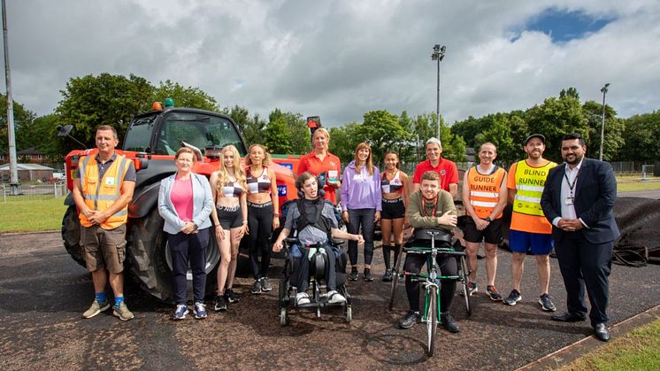 Athletes welcome the replacement of the running track, with (far right) Cllr Tamoor Tariq.