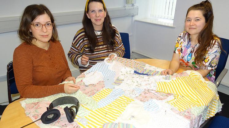 Dr Angelika Strohmayer working on the quilt with colleagues from Swansea and Aberystwth Universities