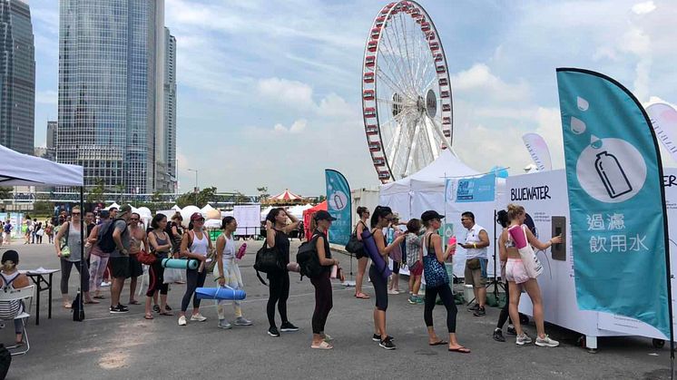 Yoga fans line up for water as pure as nature intended from Bluewater hydration station at Hong Kong's open-air IRIS yoga and meditation festival