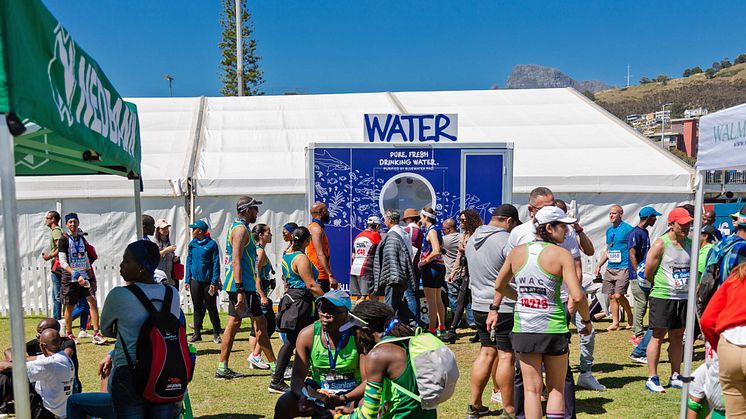 Thirsty marathon finishers filled their water bottles at the Bluewater water station sited strategically in the race village 