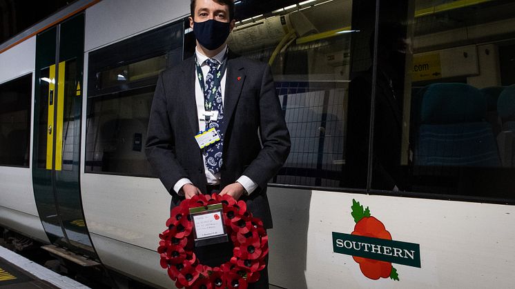 Chris Fowler, Customer Services Director for Southern, welcomes the poppy train into platform 8 (driven by forces veteran, Marc Stoner)