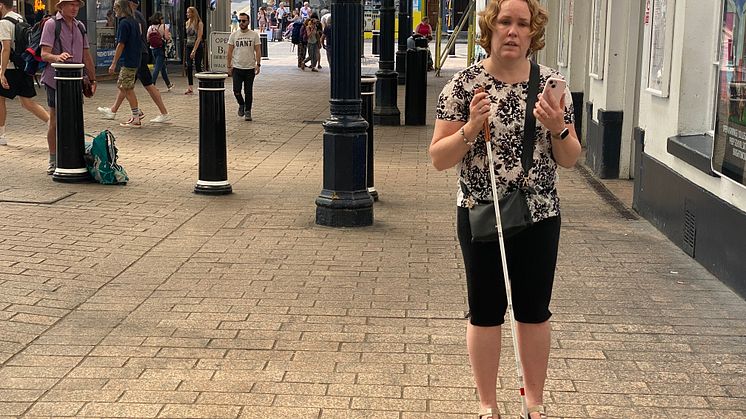 Linn Davies is guided into Brighton station using the Aira app