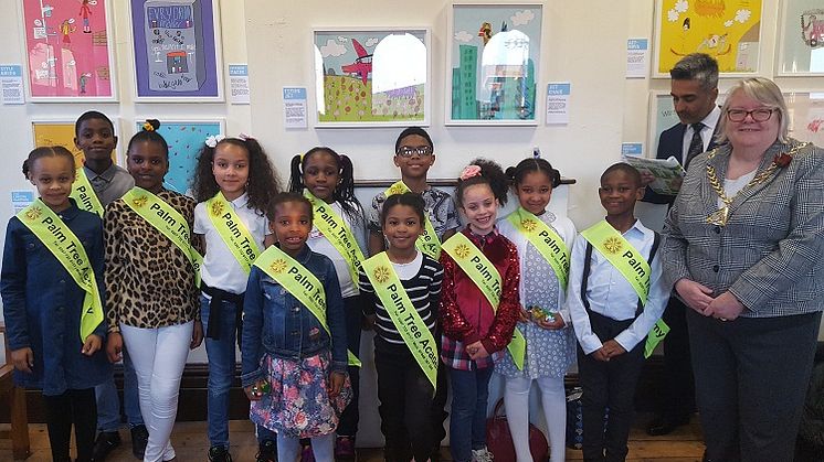 Palm Tree Academy pupils display their work at Peckham Rye station with Southwark mayor Kath Whittam