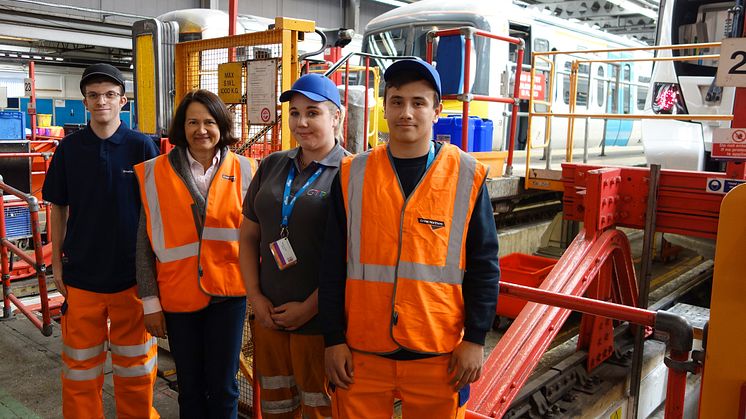 Apprentices (from left) Connor Philpot, Rosie-Jayne Wile and William Webster with MP Catherine West in Hornsey Depot