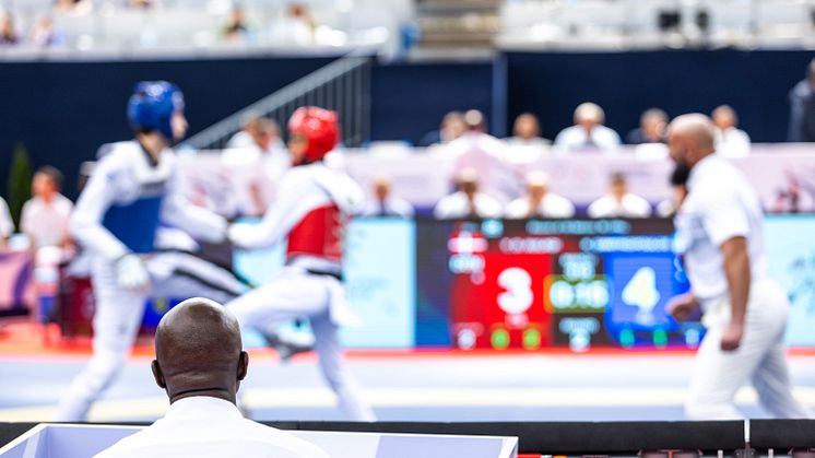 Referees and fighters at a Taekwondo competition (credit Adobe)