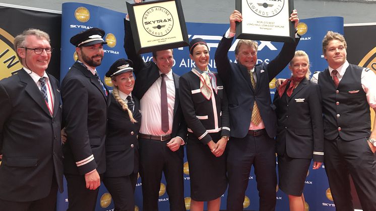 Norwegian’s Chief Commercial Officer, Thomas Ramdahl, the Chairman of Norwegian’s Board, Bjørn Kise, and crew members celebrate the Skytrax awards today at 2017 Paris Air Show