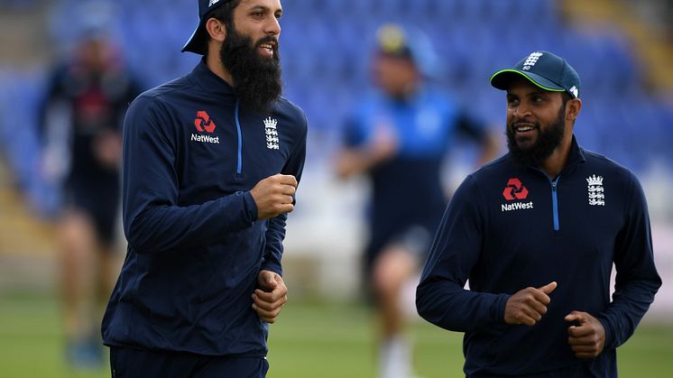 England’s Moeen Ali (L) and Adil Rashid
