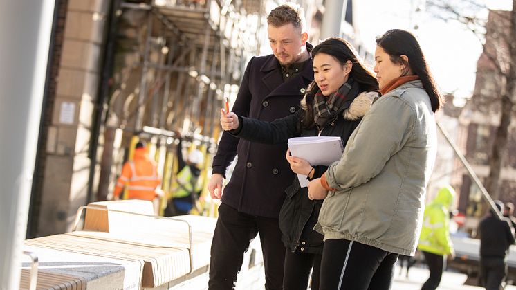 Alex Slack, Bigg Market Project Manager at NE1, pictured with two of the Northumbria students involved in the project,  Chang Shi Qian and Franz Pancho