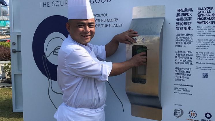 The pure water delivered from a Bluewater hydration station in the Volvo Ocean Race Village in Hong Kong puts a smile on the face of a Chinese chef .