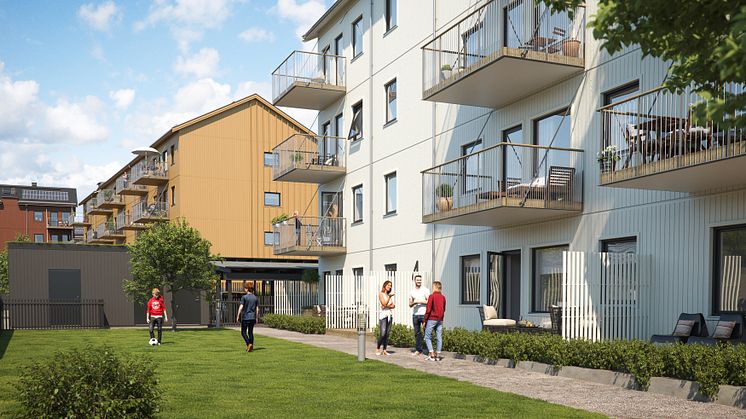Illustration av trädgårdssida med balkonger och gemensamma gräsytor, BoKlok Paraden i Upplands Väsby. 