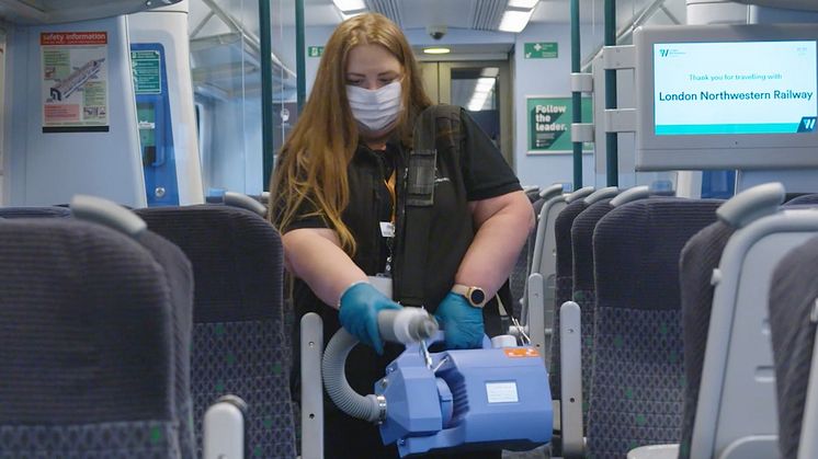 A fogging machine in use on a London Northwestern Railway train