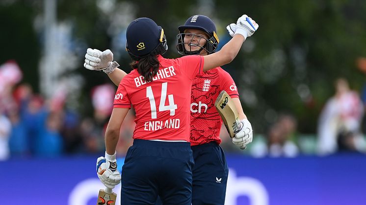 Amy Jones and Maia Bouchier celebrate hitting the winning runs. Photo: Getty Images