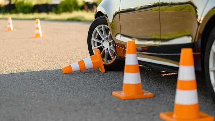 car-and-downed-cone-driving-school-concept-1024x681