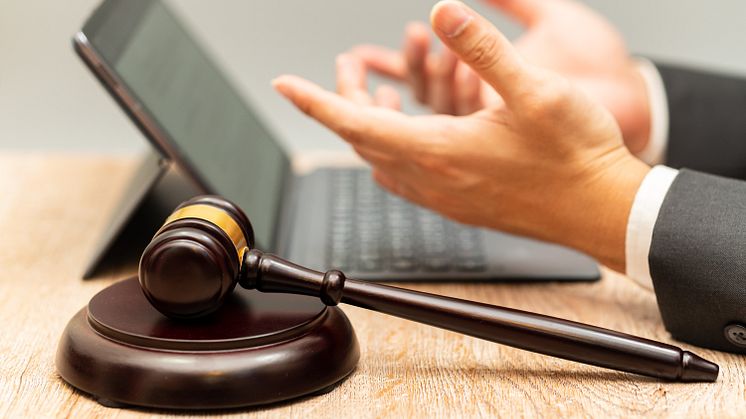 Hammer, laptop, hands - Mr. M Nobody_Shutterstock_1870174705.jpg