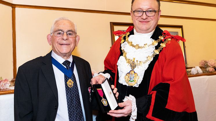 Picture: Henry Donn is presented with his Freeman of the Borough medal by the Mayor of Bury, Cllr Tim Pickstone.