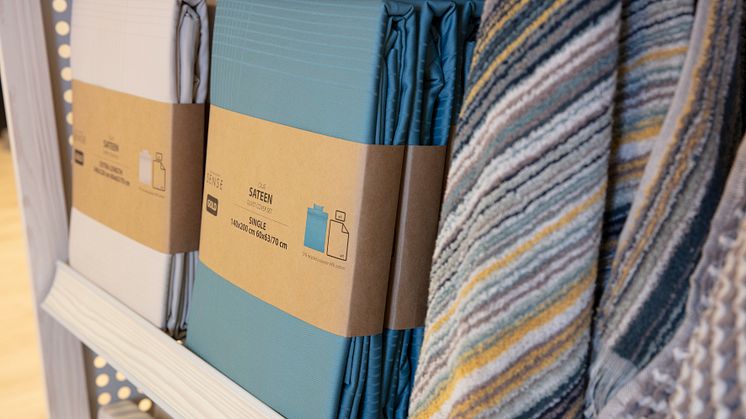 Neue Umverpackung mit Papierstreifen