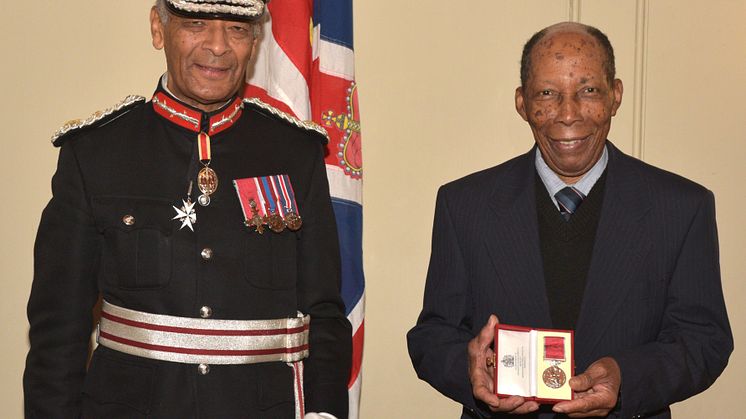 Siggy Cragwell receives his British Empire Medal from the Lord-Lieutenant of Greater London, Sir Kenneth Olisa OBE.jpg