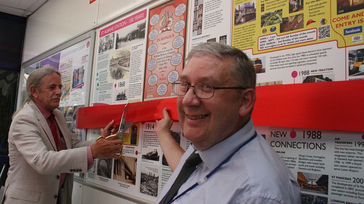 A ribbon cutting marks the unveiling of the history panel at St Albans City station