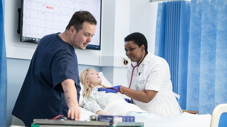 Lecturer Barry Hill with nursing student Florence Pobee