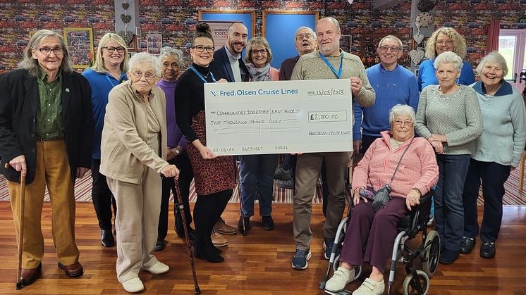 Ellis Orchard, from Fred. Olsen Cruise Lines, and Henry Tapp, from Suffolk Community Foundation, with Tracey Evans and Colin Baldwin and those enjoying the Ipswich Chinwag group
