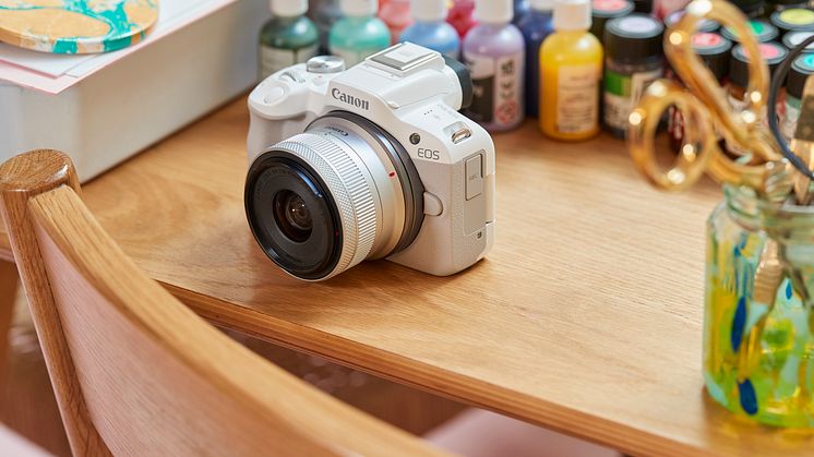 EOS R50-ambient-high-angle-white-camera-marbling-table-paints