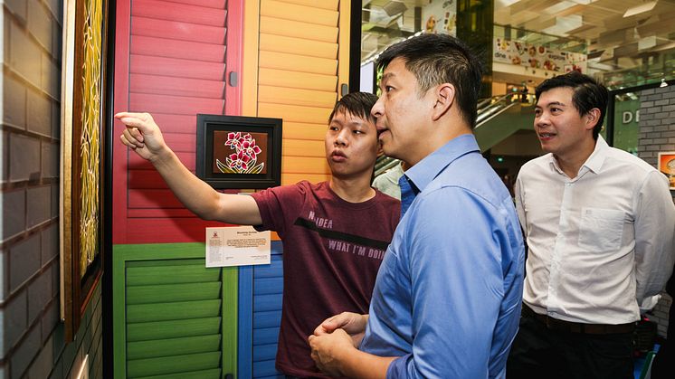 Seah Chee Meng, resident artist at Metta Welfare Association, Speaker Tan Chuan-Jin and CAG CEO Lee Seow Hiang at the inaugural Changi Inspires Art Fair