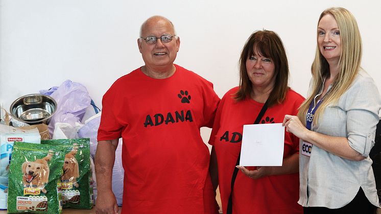 Hugely appreciated: ADANA's Reg Winkworth and Susan Brown accept cash and supplies donations from ECC's Sharon Johnson