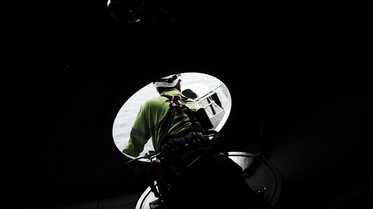 GWS Technician with harness looking out