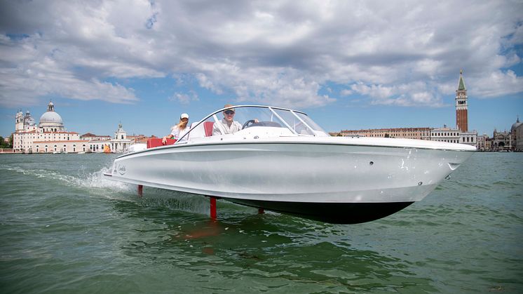 The ultra efficent, hydrofoiling Candela C-7 flying across the Gran Canale in Venice.