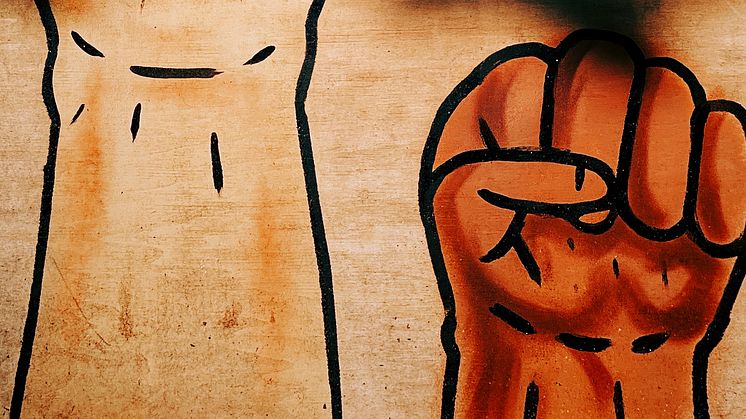 Raised fist by Jon Tyson