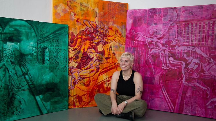 Award winning Fine Art student, Sophie Woodward, pictured with some of her paintings