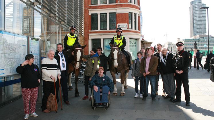 Brighton station manager Anthony Dowsett (third from left) gave disabled people a train ride to London Blackfriars station to help foster independent travel. They were welcomed there by the mounted branch of the City of London Police