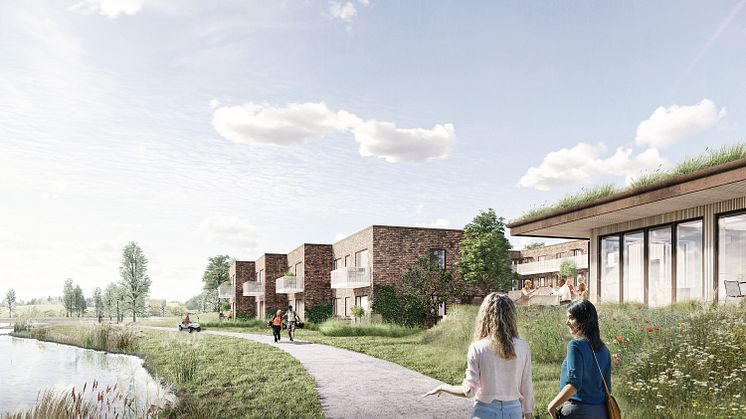 Det nye seniorbofællesskab ligger direkte ud til sø og golfbane.