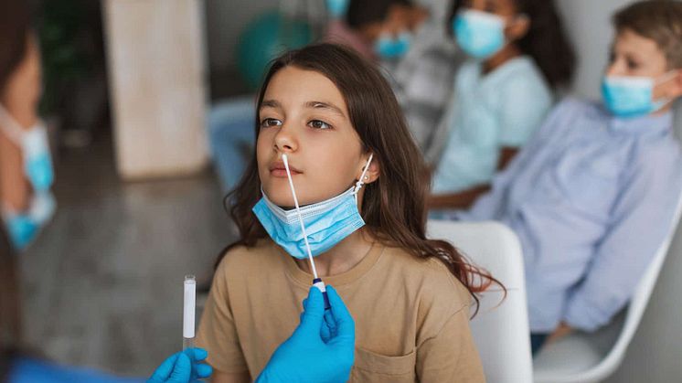 girl-getting-tested-for-coronavirus-sitting-with-c-2021-12-09-06-07-12-utc