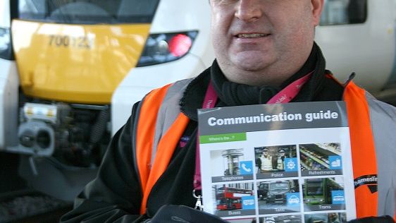 Pick a picture: platform assistant Daniel displays Govia Thameslink's new support card for passengers with communication difficulties