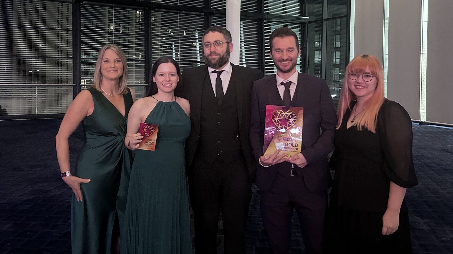 L-R: Claire Hubert, Terri Overett, Daniel Hawes, Ben Williams and Jade Ratley with Fred. Olsen Cruise Lines' UK Customer Experience Awards (Image at LateCruiseNews.com - October 2024