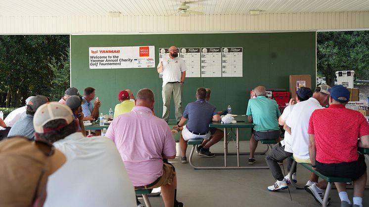 Doug Belisle from the Good Neighbor Homeless Shelter addresses golfers at the Yanmar America 3rd Annual Charity Golf Tournament.