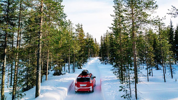 red-car-with-roof-rack-driving-on-snow-forest-road-2021-08-27-09-56-07-utc (2).jpg