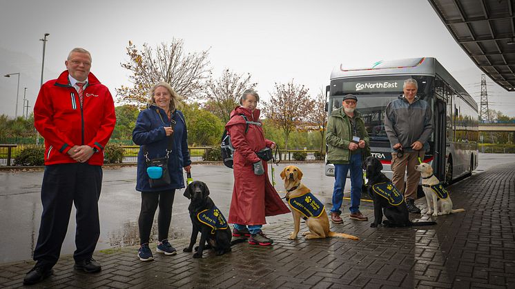 (Pictured from left to right: Go North East driver – Paul Frazer, Ashby with puppy raiser Audrey, Viva with puppy raiser Marie, Harvey with puppy raiser Paul and Esmay with puppy raiser Mark)