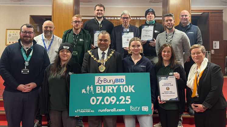 The Mayor of Bury (centre) and Councillor Eamonn O’Brien, Leader of Bury Council (left), with Bury Council running festival leads/reps from Jane Tomlinson's Run For All, The Sunnywood Project, Bury Athletics Club and Radcliffe Athletics Club