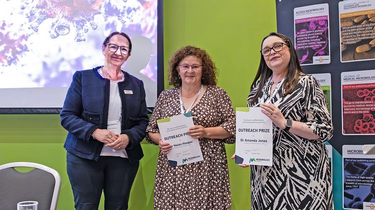 General Secretary of the Microbiology Society, Professor Karen Robinson, presents Dr Helen Hooper and Dr Amanda Jones from Northumbria University with the 2024 Microbiology Society Outreach Prize. Photo: Courtesy of the Microbiology Society