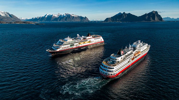 MS Midnatsol (left) and recently renamed MS Finnmarken (right) cross paths on the Norwegian coast (Photo: Hurtigruten/Tommy Simonsen)