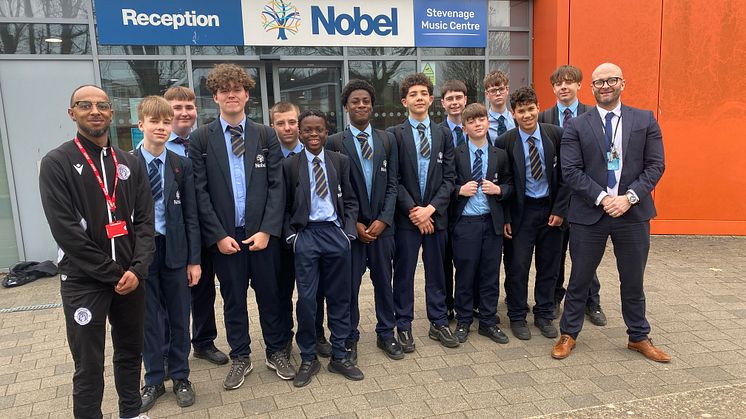 On target for the community: Lewis Sykes (far left) of Stevenage Football Club Foundation and Danny Camp (far right), Director of Alternative Provision, with Step Up students at The Nobel School
