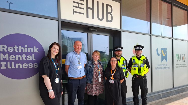 Members of Rethink, West Midlands Railway and the British Transport Police stand outside 'The Hub' at Wolverhampton station