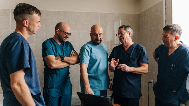Doctor Rickard Brånemark, second from the right, prepares his team for an operation.