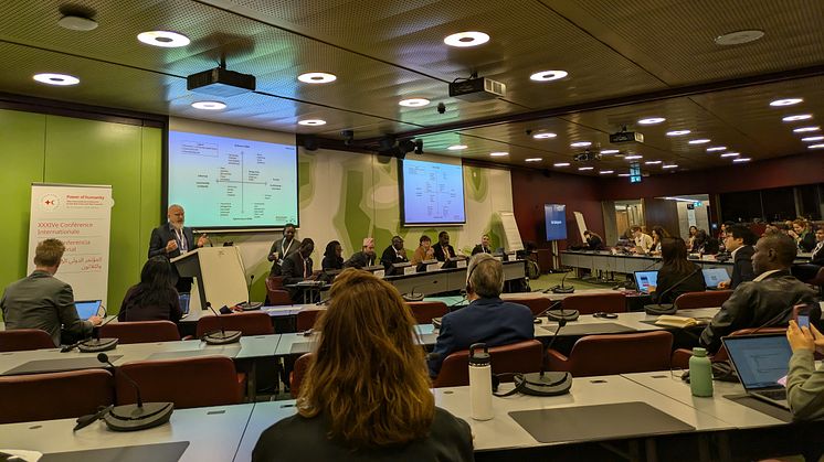 Professor Matt Baillie Smith speaking in Geneva at the International Conference of the Red Cross and Red Crescent.
