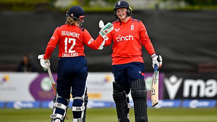 Bryony Smith of England celebrates with team-mate Tammy Beaumont after bringing up her half century. (Photo by Sam Barnes - ECB/ECB via Getty Images)