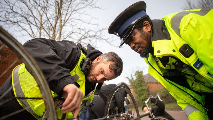 Bike registration sticker being applied